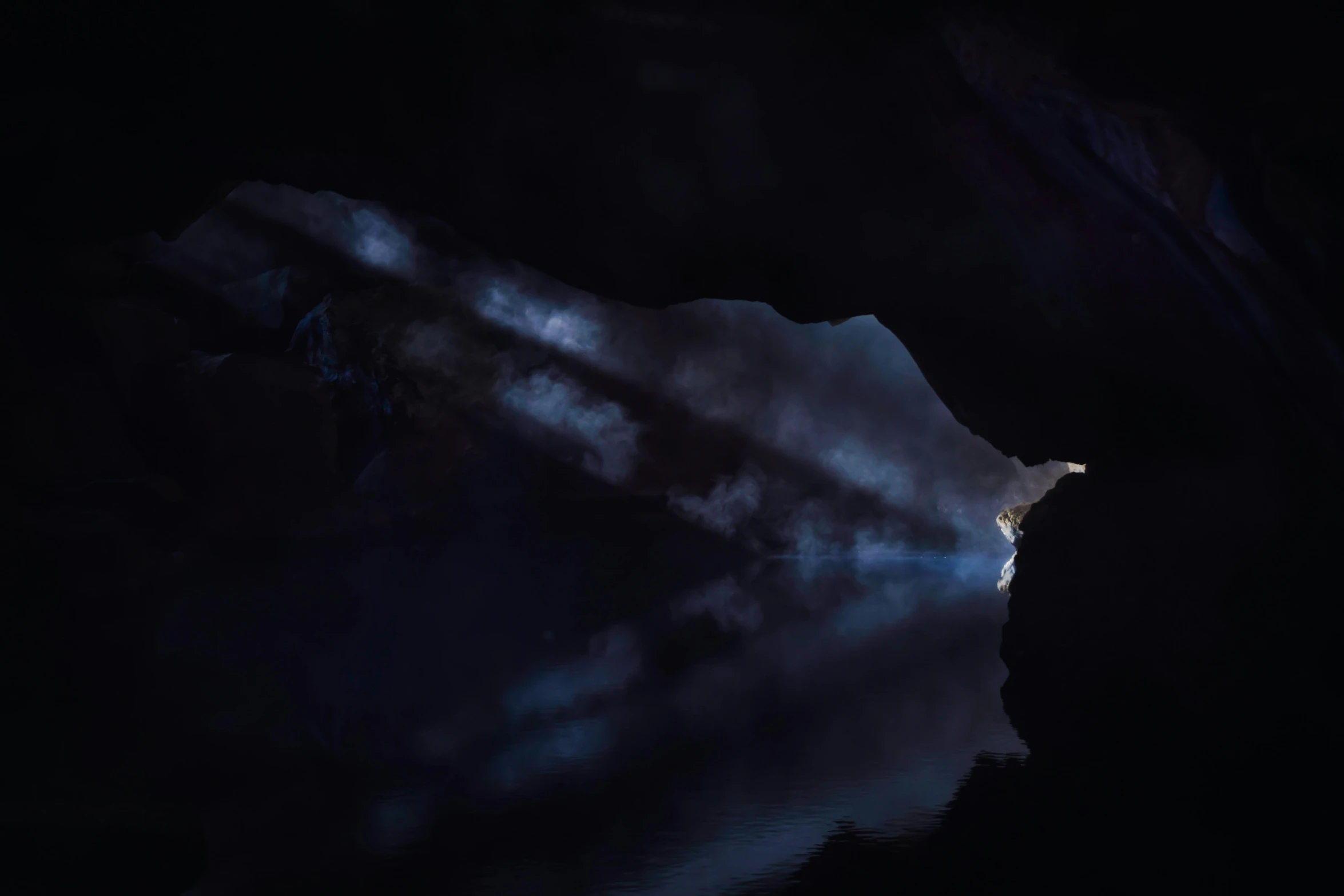 a dark night at a cave, with a glacier