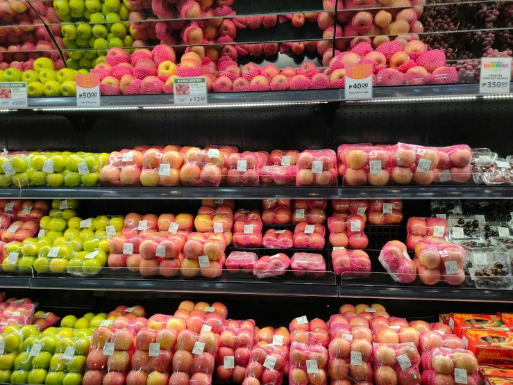 a display in a store that sells all types of fruit