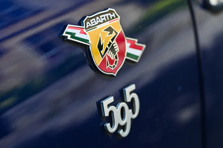 a shiny chrome emblem on the back of a vehicle