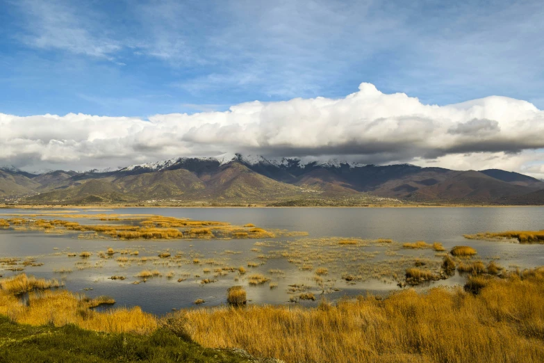 a very pretty landscape with mountains and water