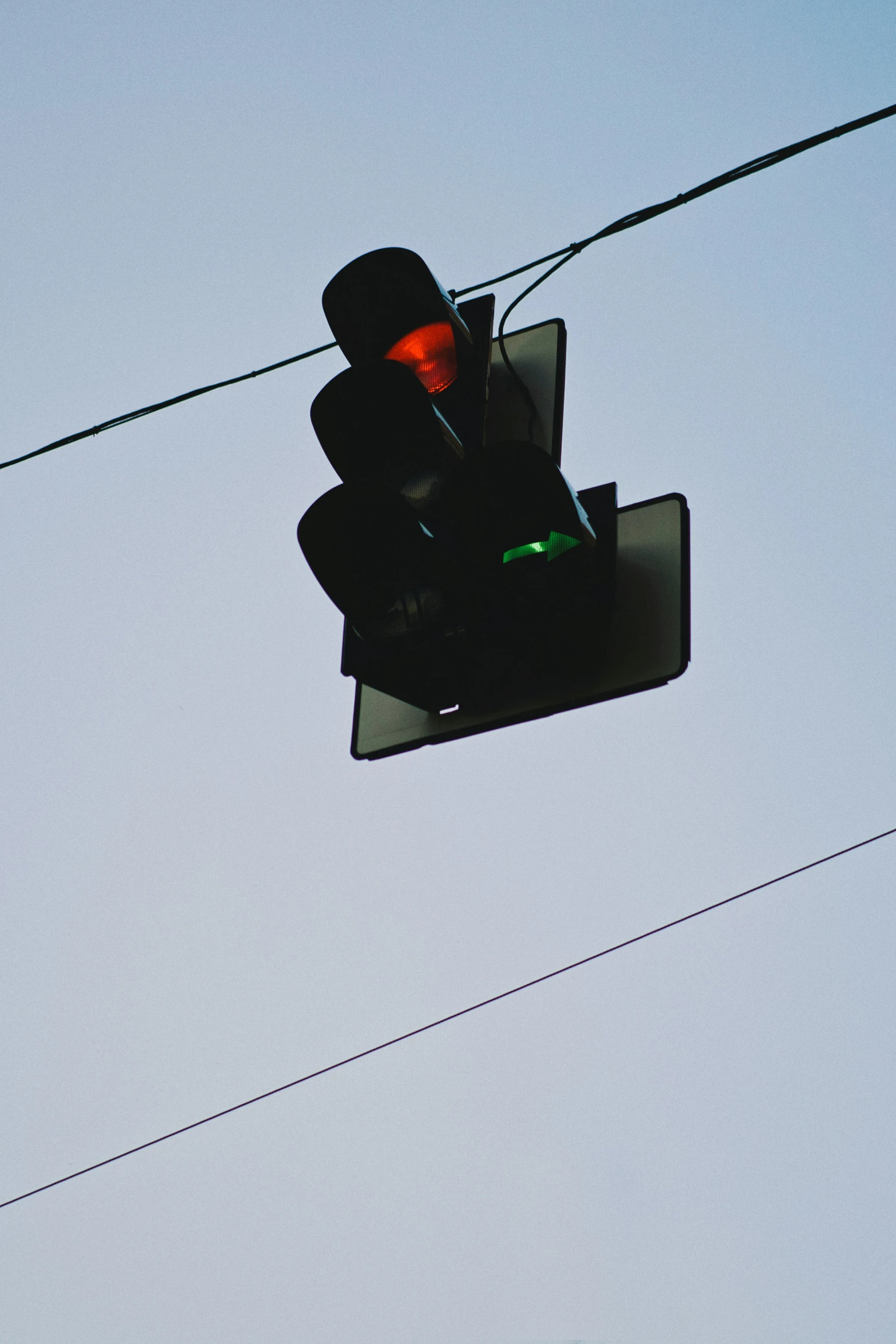 a traffic light attached to an electrical wire