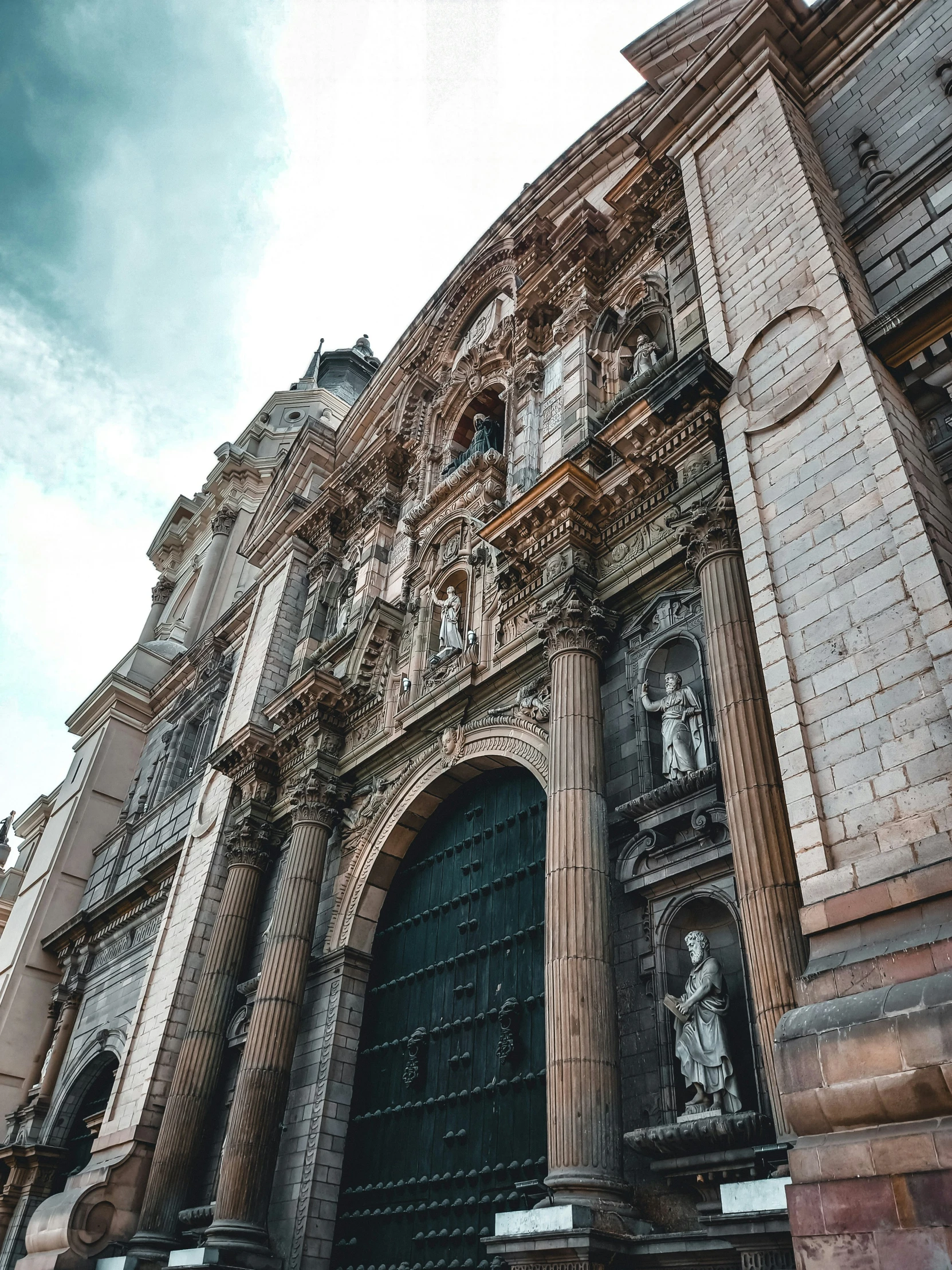 a tall building with ornate decorations on it