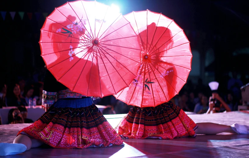 two red umbrellas are sitting next to each other