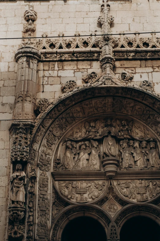 a decorative entrance door with arched windows on a building