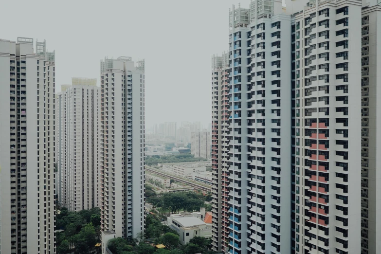 a couple of tall buildings near one another