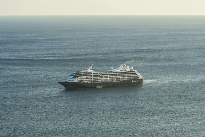 a large boat in the water near shore