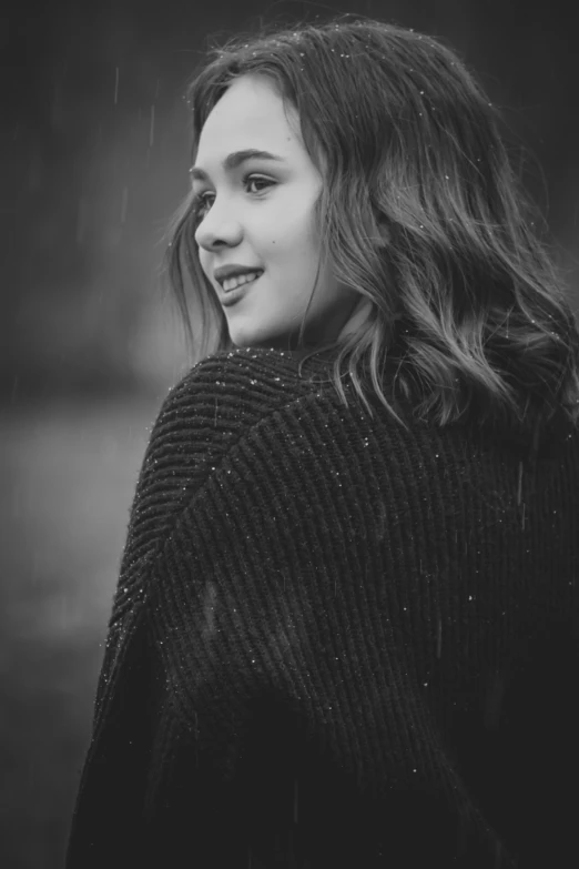 a girl in black and white posing for a pograph