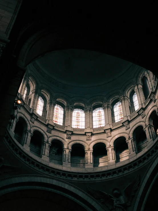 the interior of a church with two arched windows