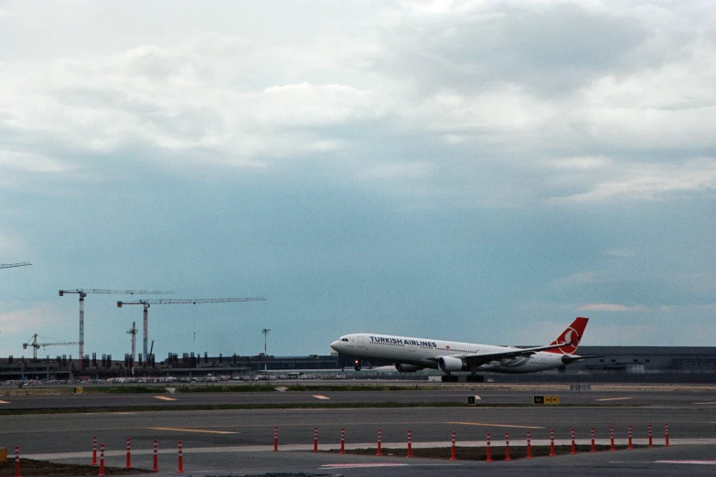 an airplane on the runway with it's landing gear down