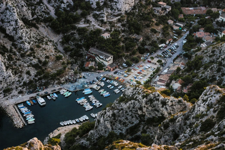 a marina with lots of boats in it on the water