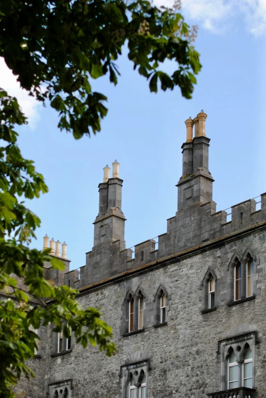 an old castle with the sky in the background