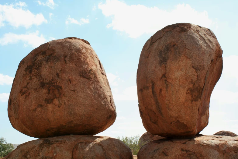 two large rocks are standing close together