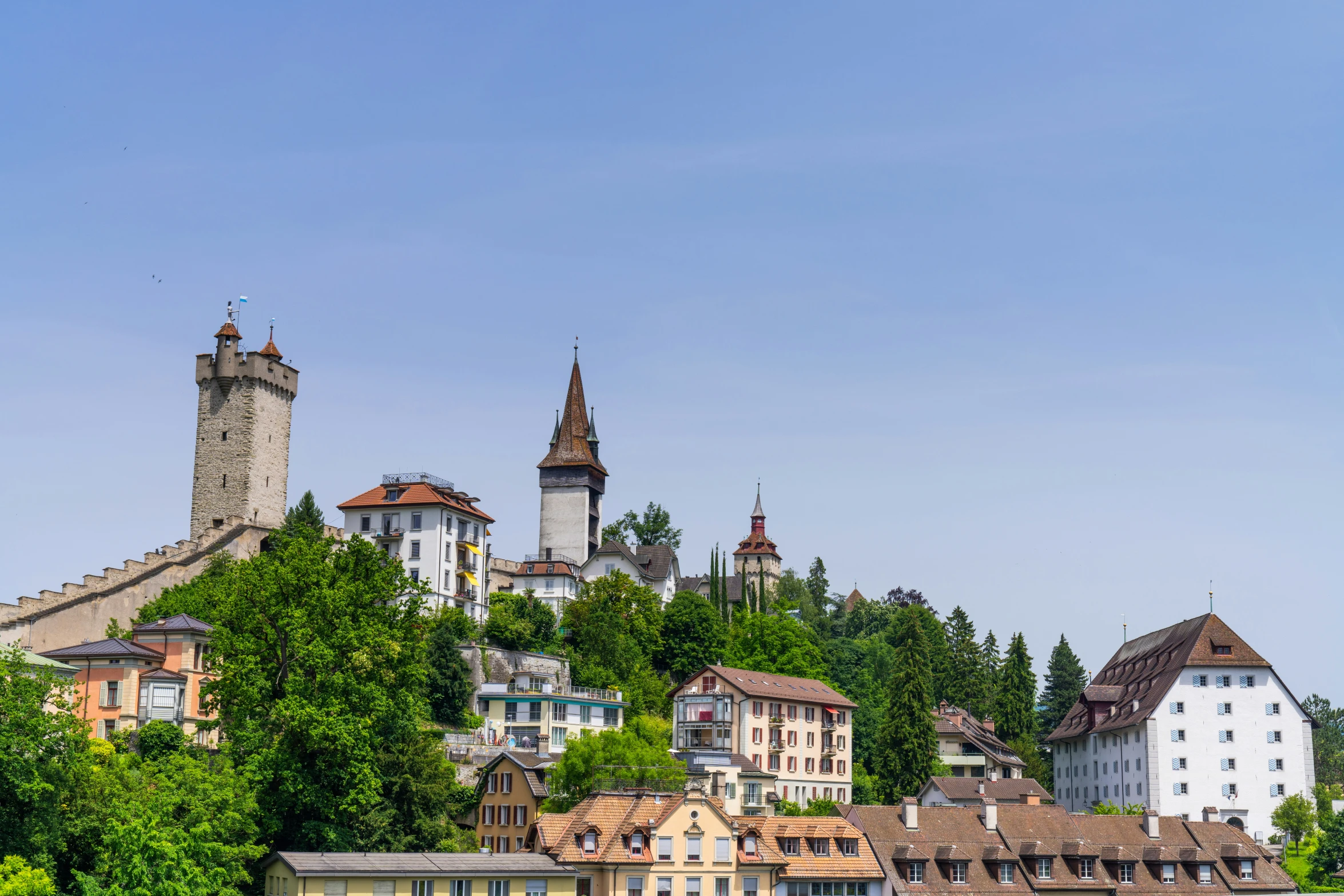 the buildings are sitting on top of the hill