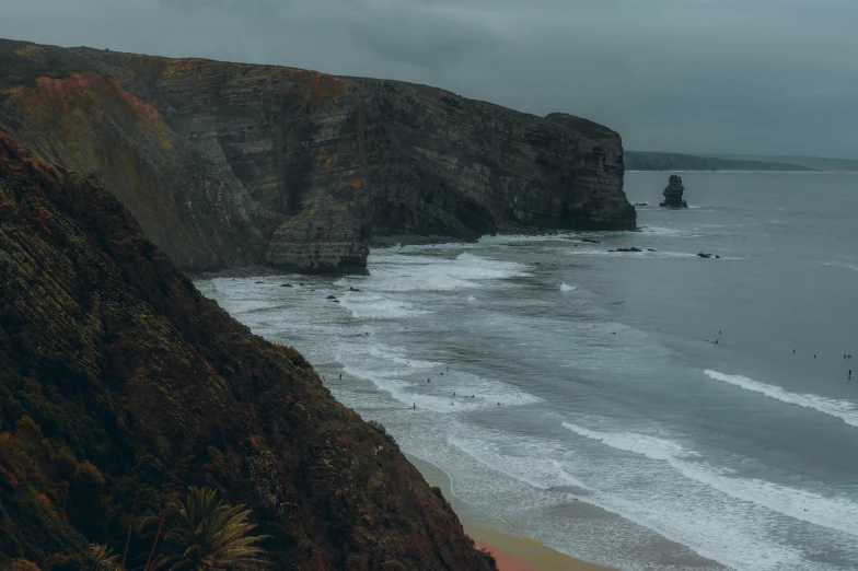 a beach with some very big waves coming in