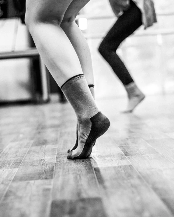 two people dance in the middle of an exercise