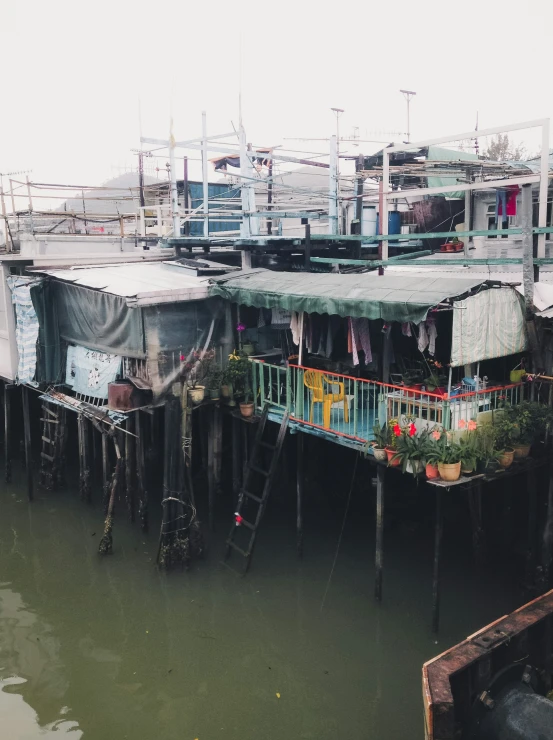 some houses that have a balcony and lots of windows