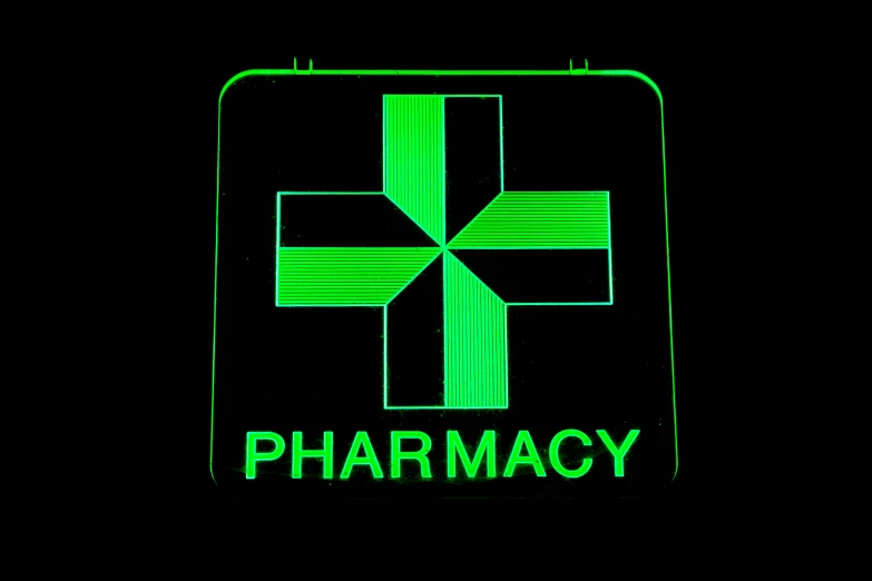 pharmacy square icon in green on a black background