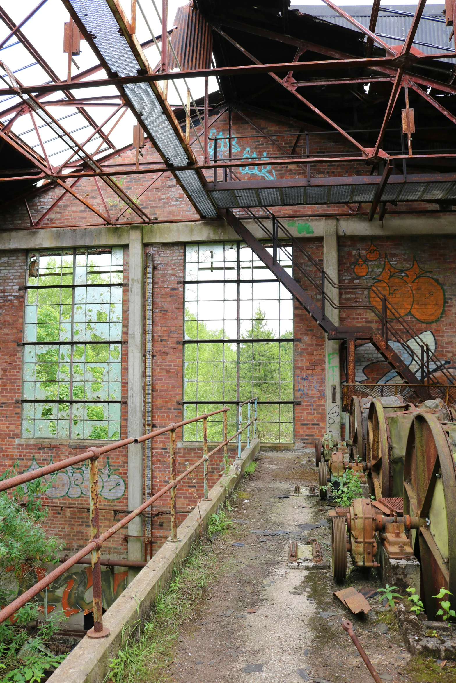 an industrial building with pipes and windows