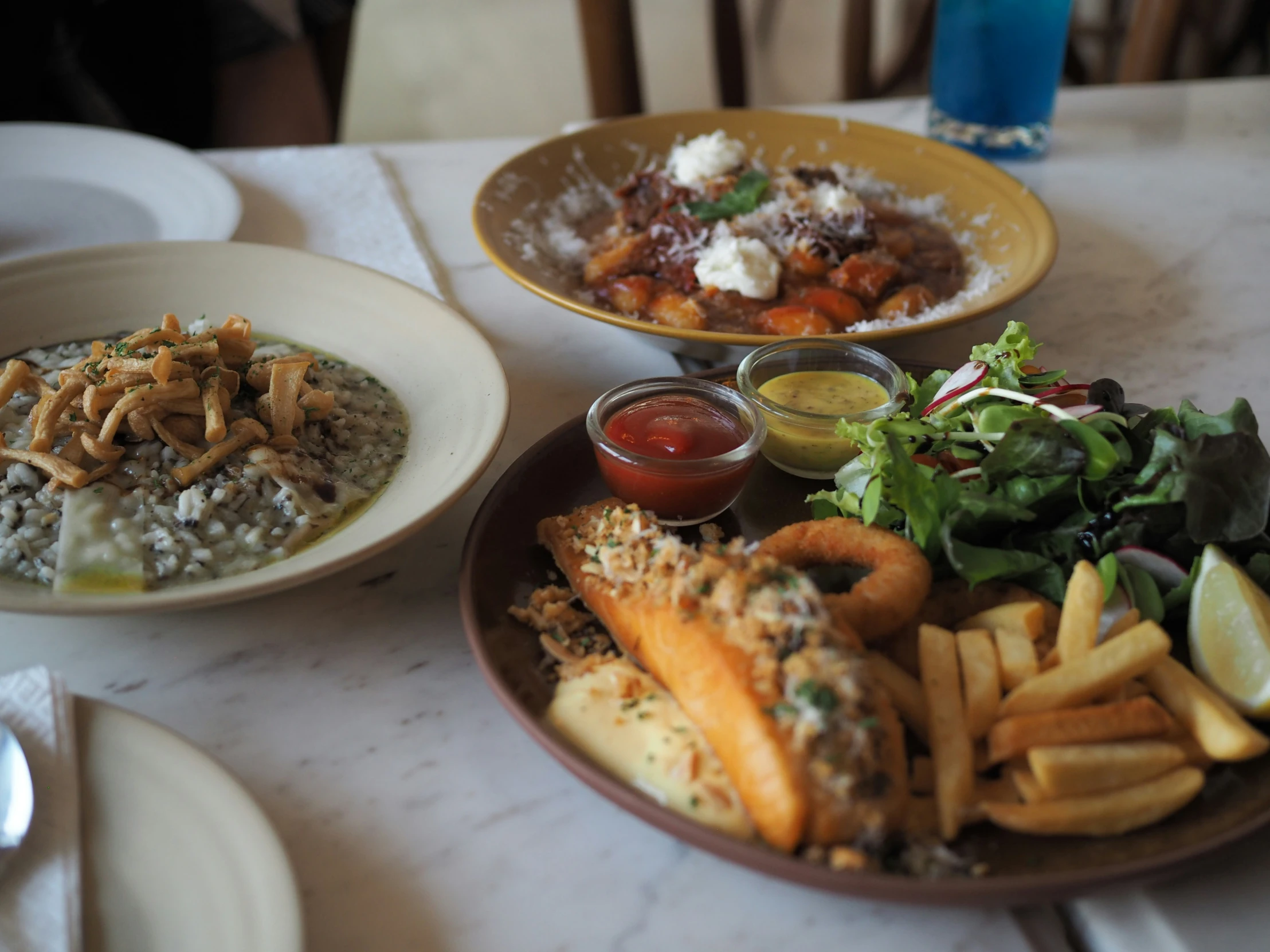 several different plates with food on them sitting next to each other