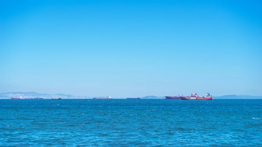 two large ships in the open blue water