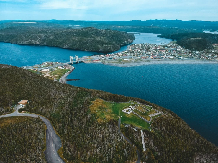 an aerial view of a city and the water