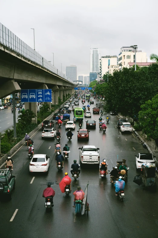 vehicles and bikes driving on the road in heavy traffic