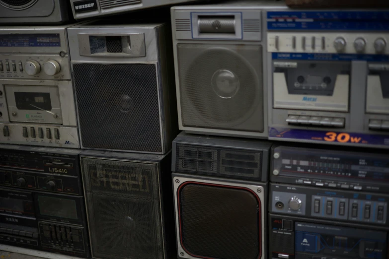 an array of boomboxs and stereo equipment for sale
