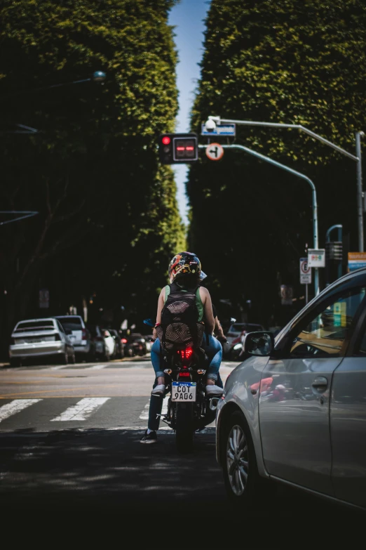 a person riding on the back of a motorcycle