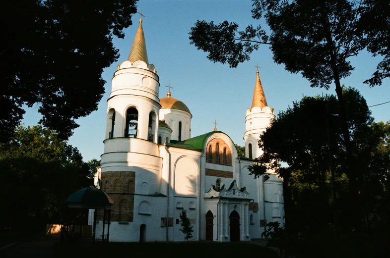 there is a white church with towers in the foreground