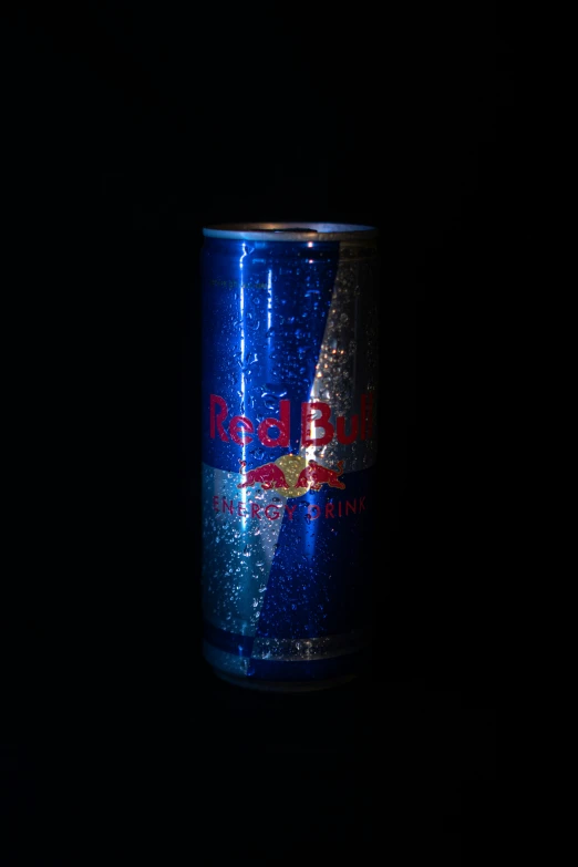 a tin can is shown against a dark background