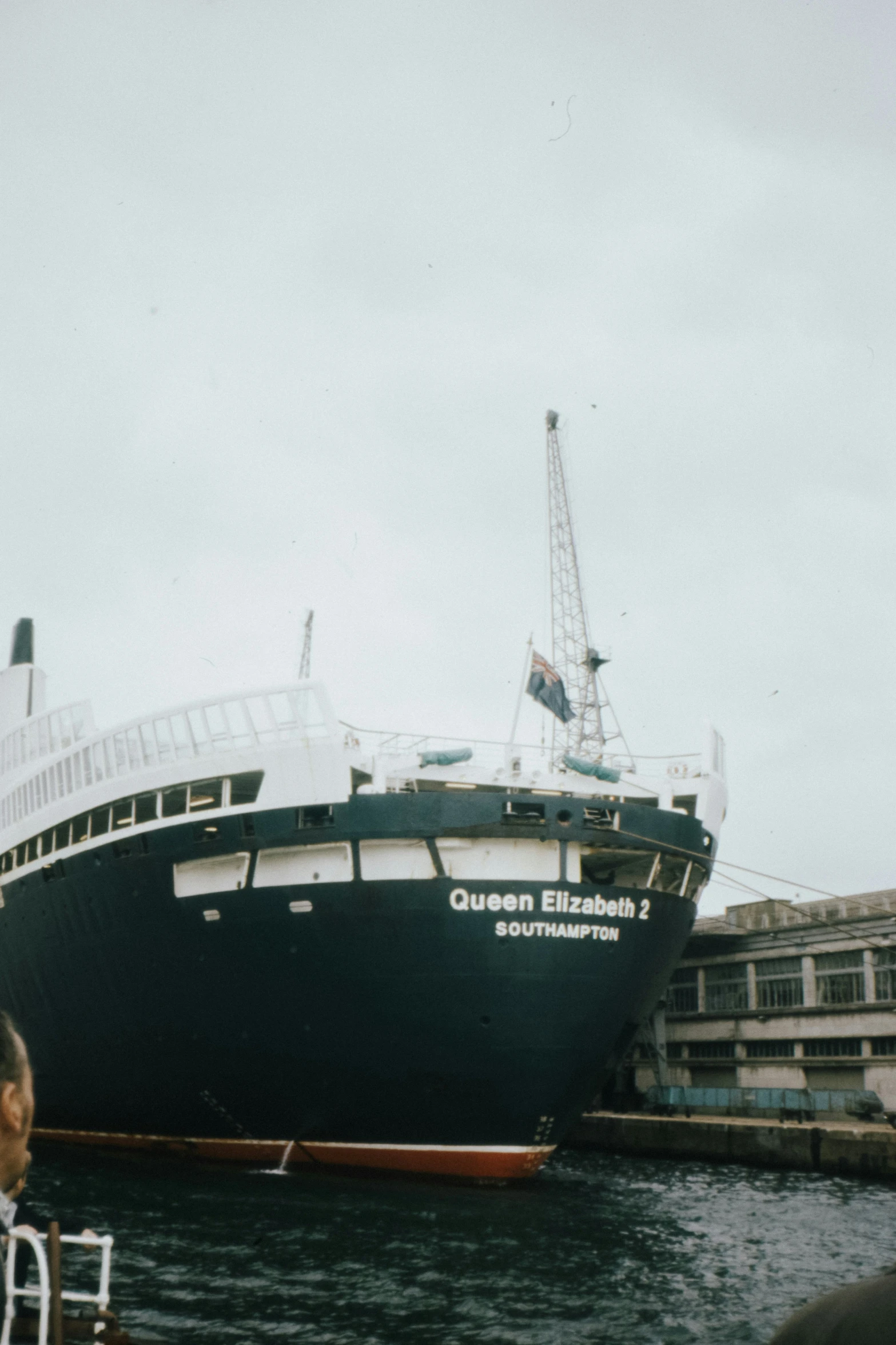 a boat is pulled into the water next to the dock