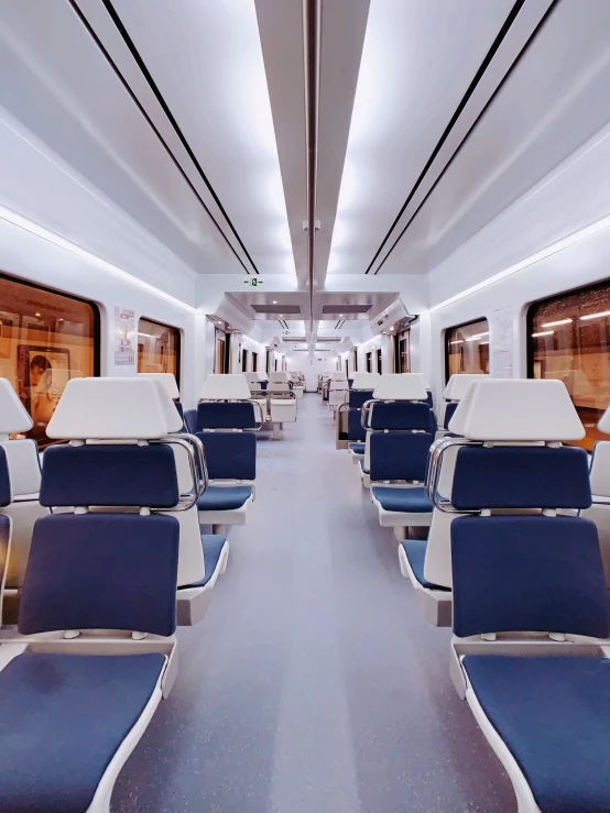 inside of a train with a bunch of seats