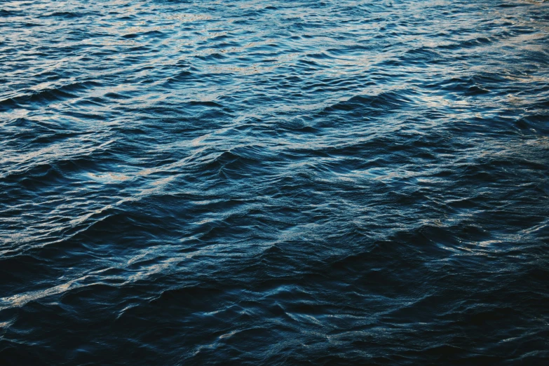 a very dark blue surface of some kind of water