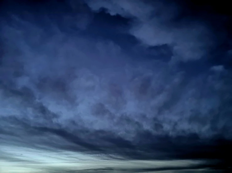 large dark clouds are hovering in the sky