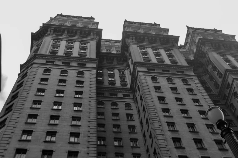 several windows and balcony structure on a tall building