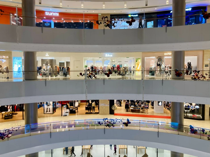 a mall filled with people and lots of windows