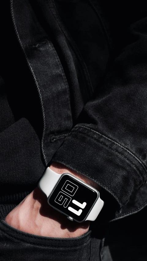the electronic watch is on top of a mans wrist