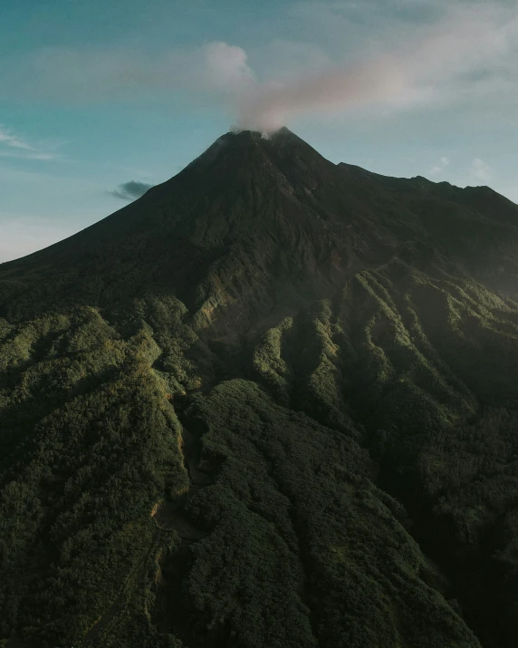 the sun lights up a very large mountain range