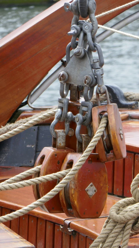 the ropes are tangled on a large brown boat