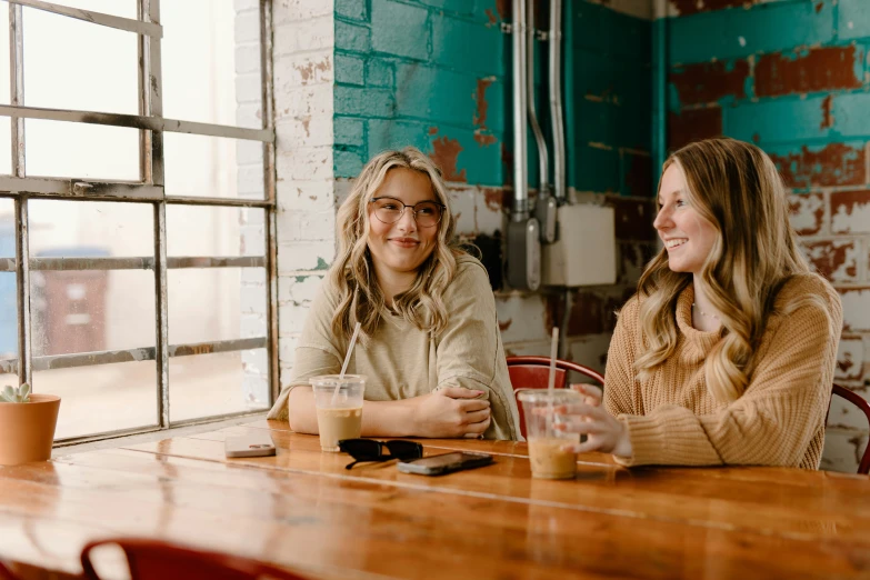 two women at a table in an old building