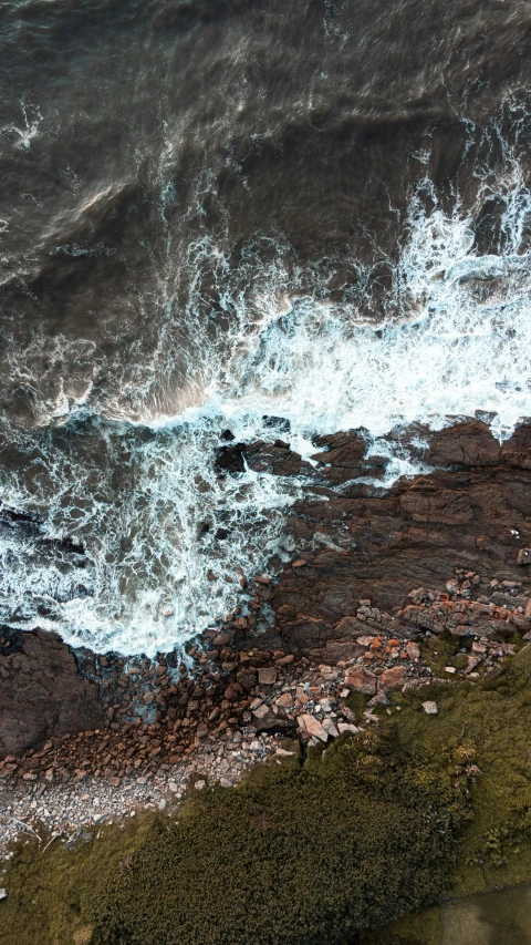 aerial view of the ocean with blue water