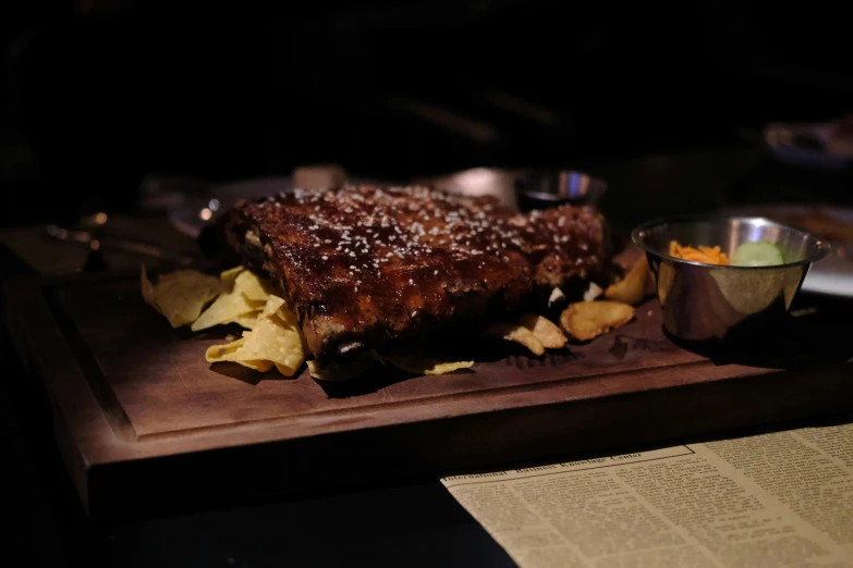 a plate of food with chips and a sauce on it