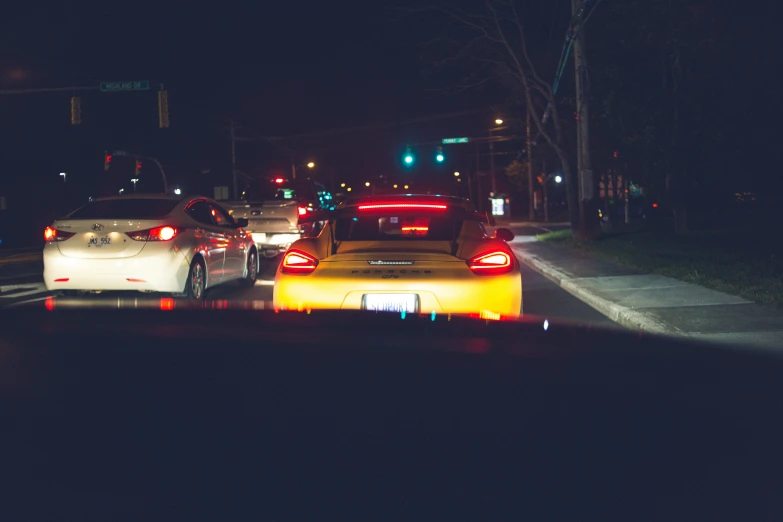 a night s of three cars on a street