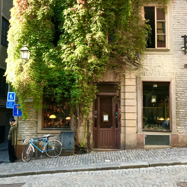 a bike is parked outside of the brick store