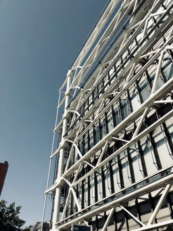 the side of an architectural building with lots of windows