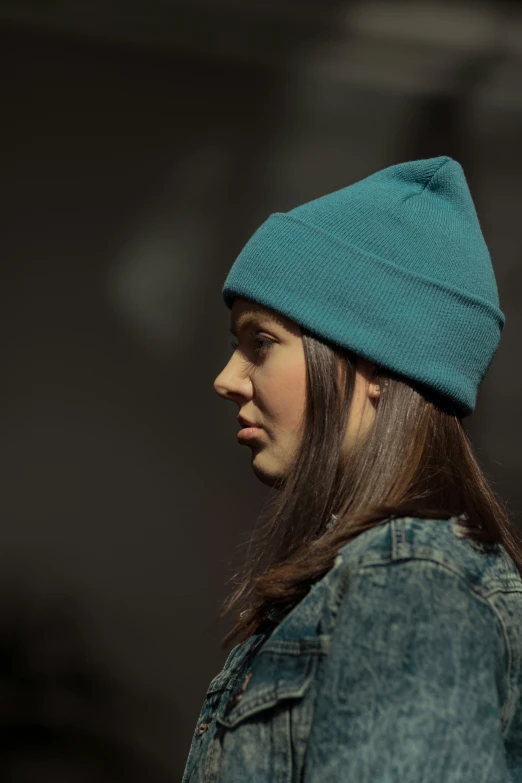 a woman with a blue hat on her head