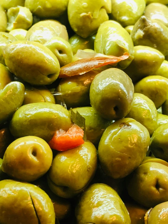 green and yellow olives with tomato, peppers and other vegetable items