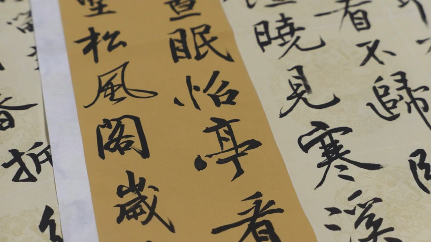 three old japanese scrolls with calligraphy on them