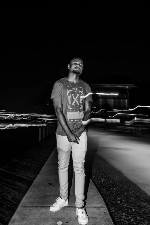 a person standing on the edge of a pier