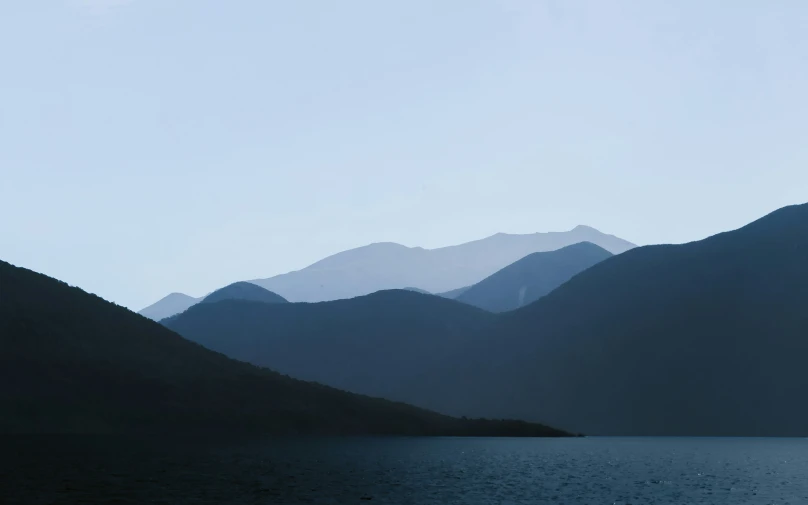 a beautiful view of mountains with blue water